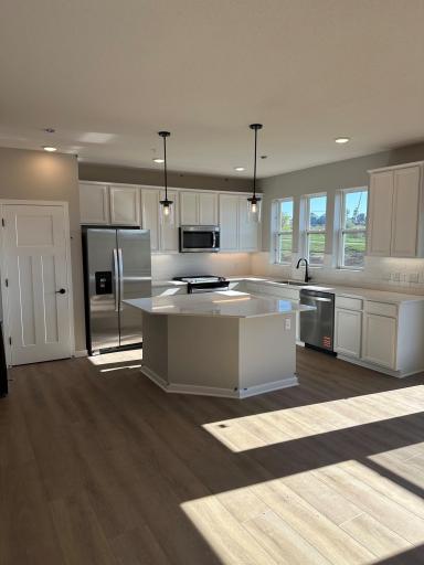 A spacious kitchen with large center island in a similar Duncan end home