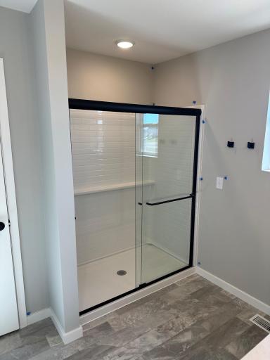the shower door matches other bath hardware in a similar Duncan end home
