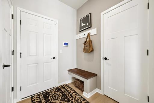 The Boot bench adorns the back hall, as shown in the Hadley model