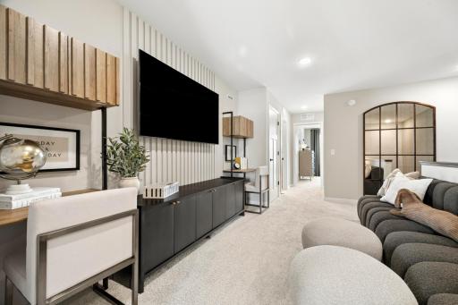 A loft is a great central point to the upper level of the home, as shown in the Hadley model.
