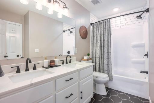 Updated main bath, walk-thru to primary bedroom