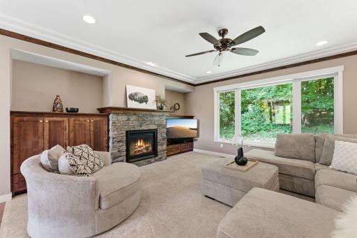 Comfortable main floor living room with gas fireplace. Relax and enjoy the view!