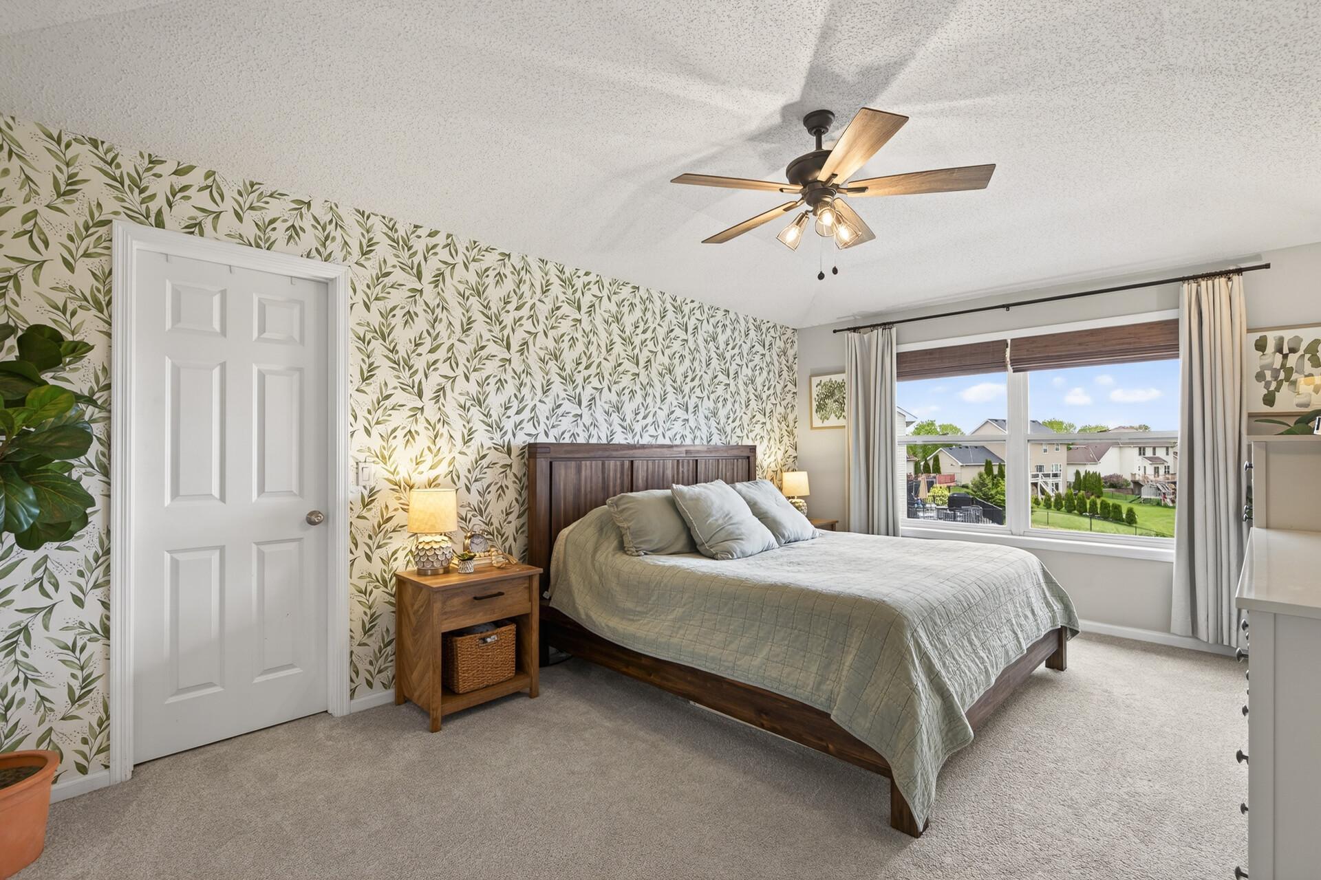 Primary Bedroom with Accent Wallpaper, Walk-in Closet and Primary Bathroom En-suite