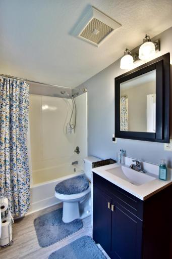 Off the living room is a nicely updated full bathroom