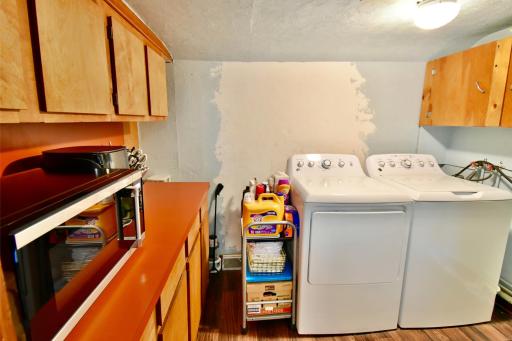Just off the kitchen is your laundry area and some additional cabinets