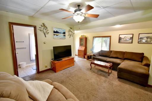 The living room area is spacious enough for a sectional and additional furniture!