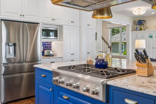 Gas range, stainless steel refrigerator, microwave.