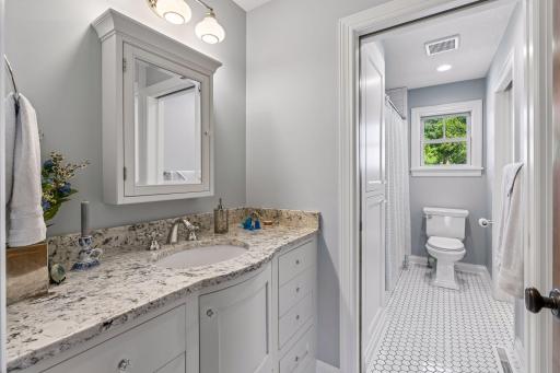 Elegantly styled bath with separate areas for privacy.