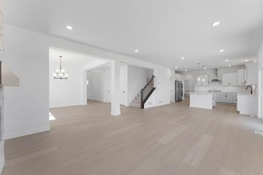 (Photo of a similar home, actual finishes may vary) Situated in front of glass sliders, this nook provides a perfect place for sun-dappled meals that can venture out to the backyard.