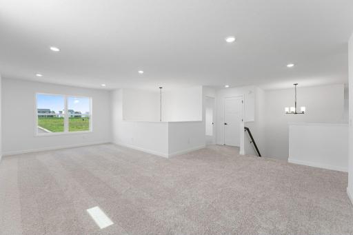 (Photo of a similar home, actual finishes may vary) The upstairs loft is multipurpose in nature and can function as another common area for doing homework, playing games, reading books and more.