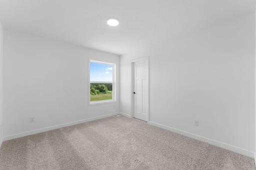 (Photo of a similar home, actual finishes may vary) Residents can customize the bedrooms as they see fit to accommodate their needs, such as adding a desk for schoolwork
