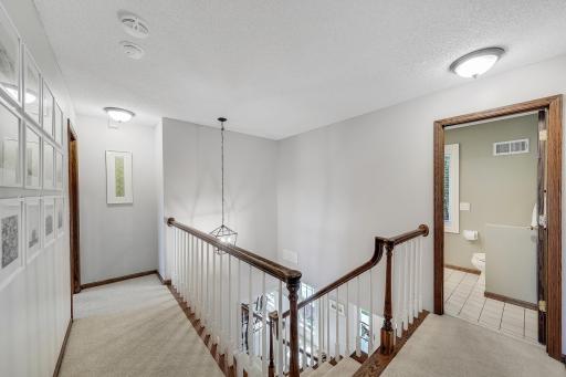Elegant staicase to 4 bedrooms on upper level