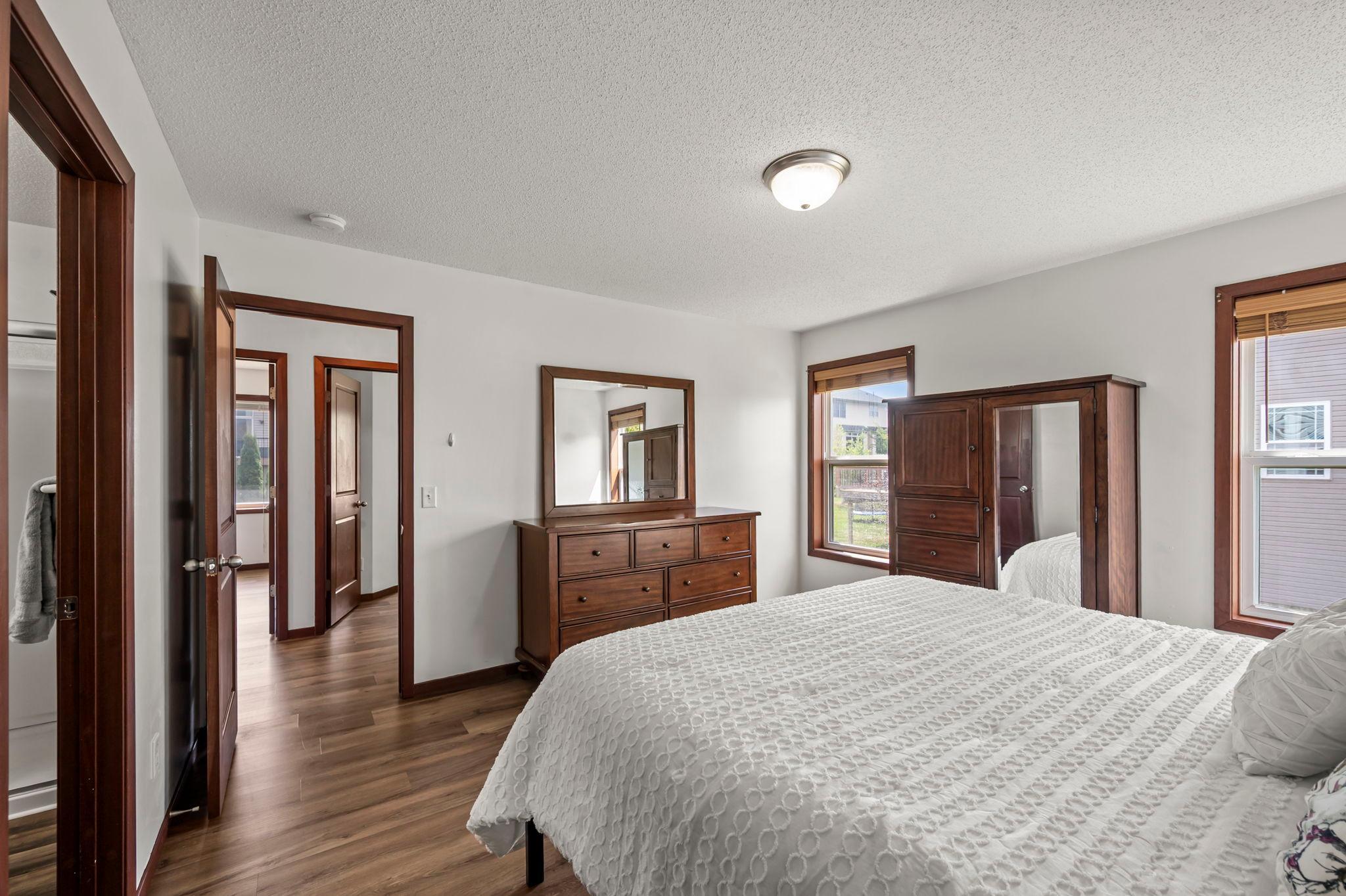 The primary bedroom windows have high quality plantation style wood blinds.
