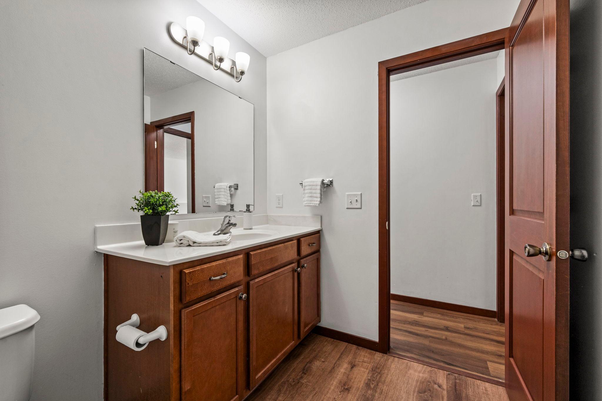This lower level full bathroom is the third bathroom in this home and has been updated with new flooring.