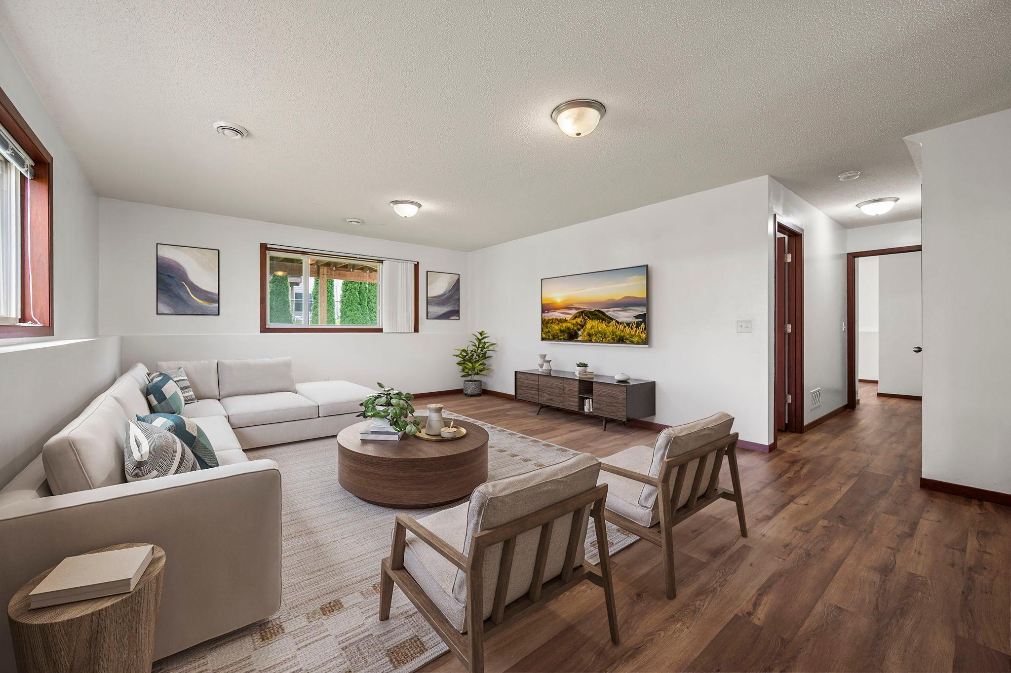 Virtually staged lower level family room.