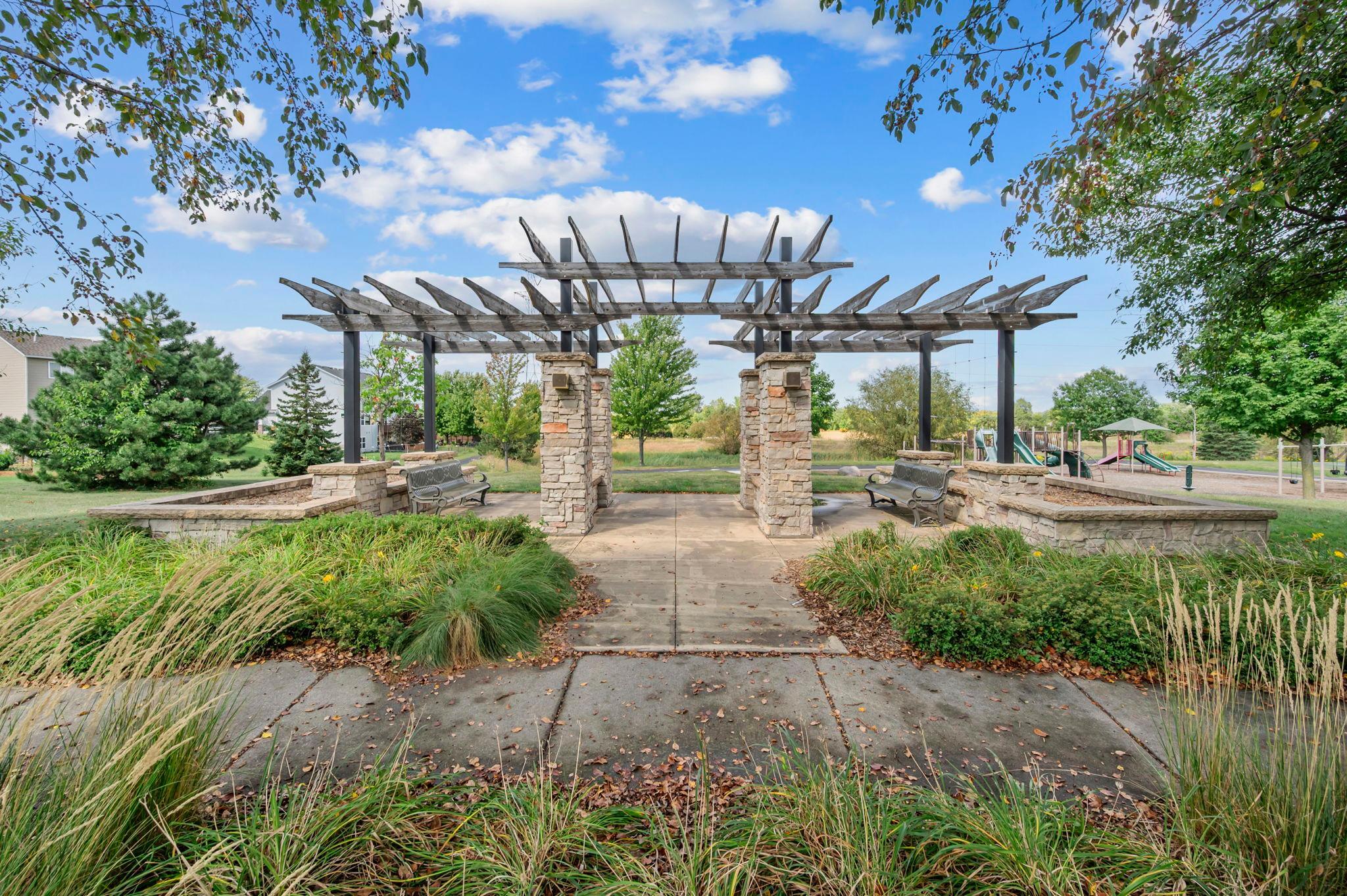A relaxation space with pergola for shade.