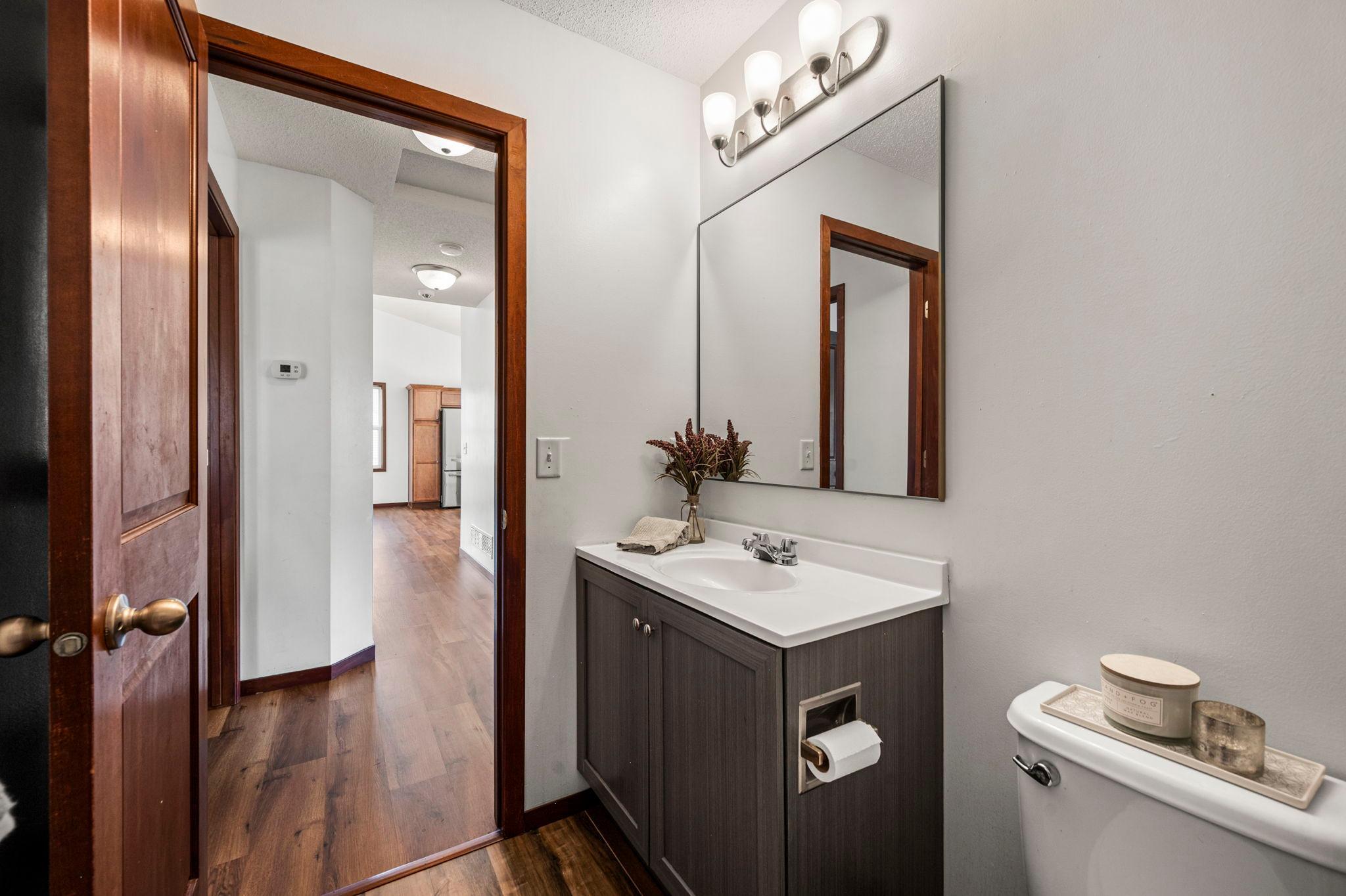 The main floor bathroom is centrally located with the bedrooms and away from the kitchen area.