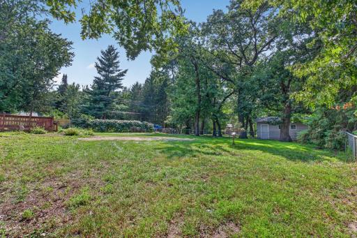 Fenced in back yard with a mix of chain link and privacy