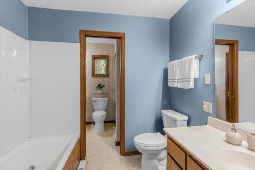 This bathroom has a door that leads into the primary 3/4 bathroom.