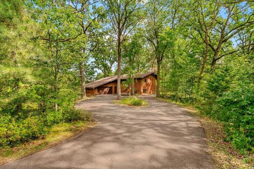 Midcentury Modern home tucked away in a wooded two acre lot.