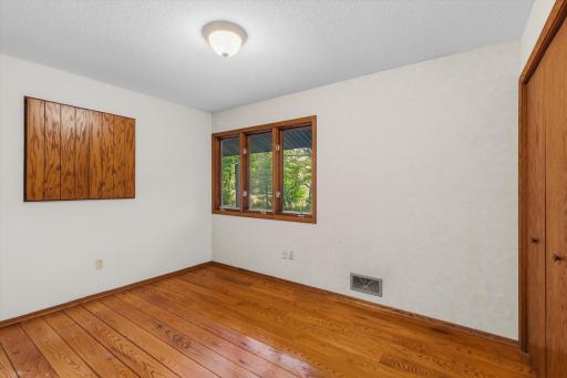 The second bedroom also features the beautiful hardwood floors plus extra storage.