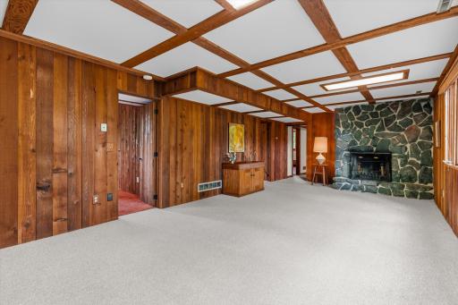 This spacious family room offers room for a seating area plus a gaming area.