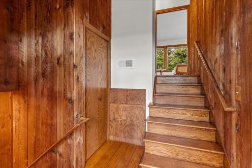 Wooden staircase, built-in drawers offer a great place to put everything away.