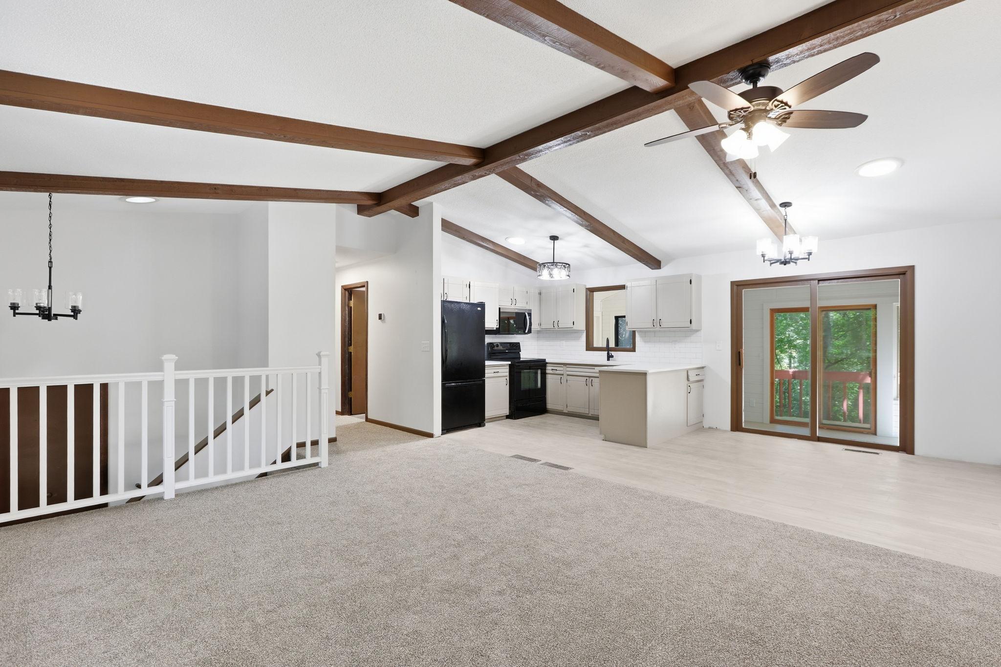 Open layout with kitchen off living room and dining room
