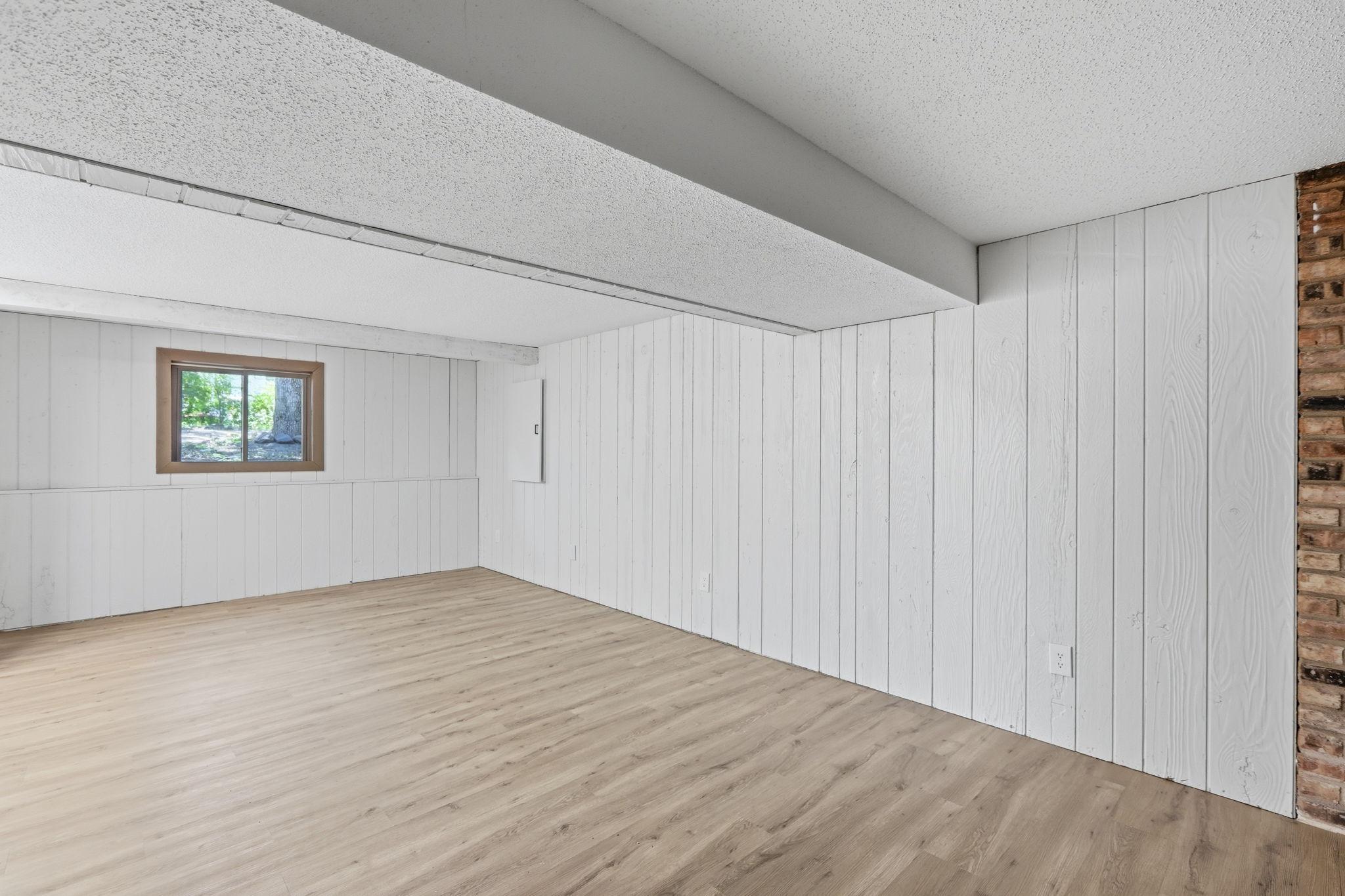 Updated basement with new flooring and paint