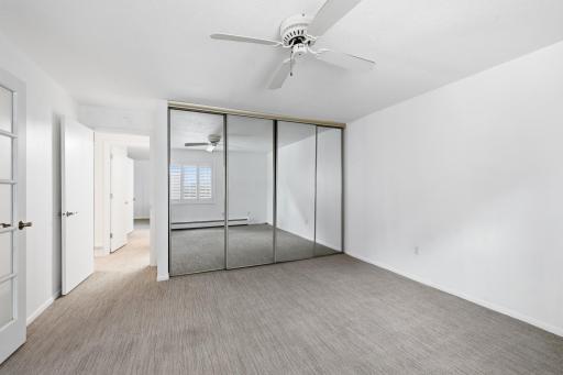 Large closet with mirrored doors