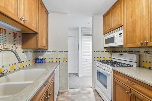 Functional galley kitchen with new dishwasher and disposal