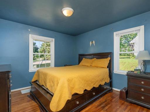 Bedroom on main level features HW floors and 2 nice sized windows!