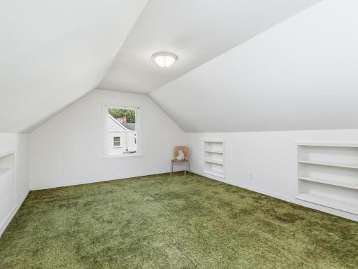 Freshly painted upper-level bedroom, built-in bookcases and nice big windows!
