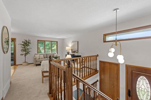 On the upper level, you will find a spacious, open concept, living room, dining room, kitchen, and screened three season porch!