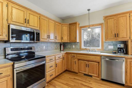 An impressive amount of custom-built oak cabinetry elevating the space with warmth and refinement.