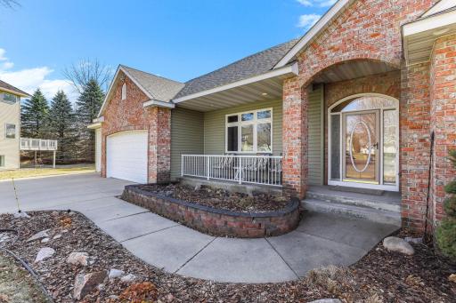 A timeless covered front porch that enhances the home’s charm and architectural presence.
