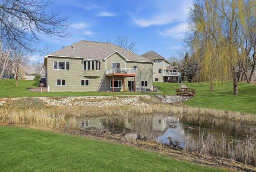 Serene pond and charming bridge—creating a peaceful and inviting outdoor retreat.