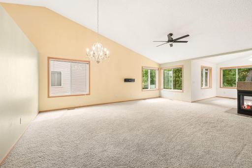 Open dining room and living room area with high ceilings