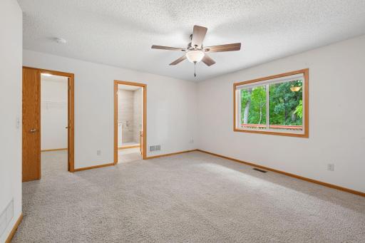Large primary bedroom with beautifully remodeled en suite bathroom