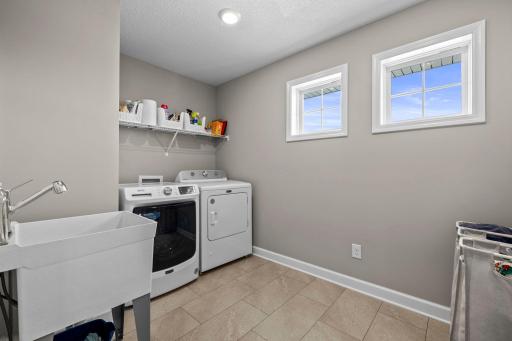 Convenient upper level laundry with a wash tub