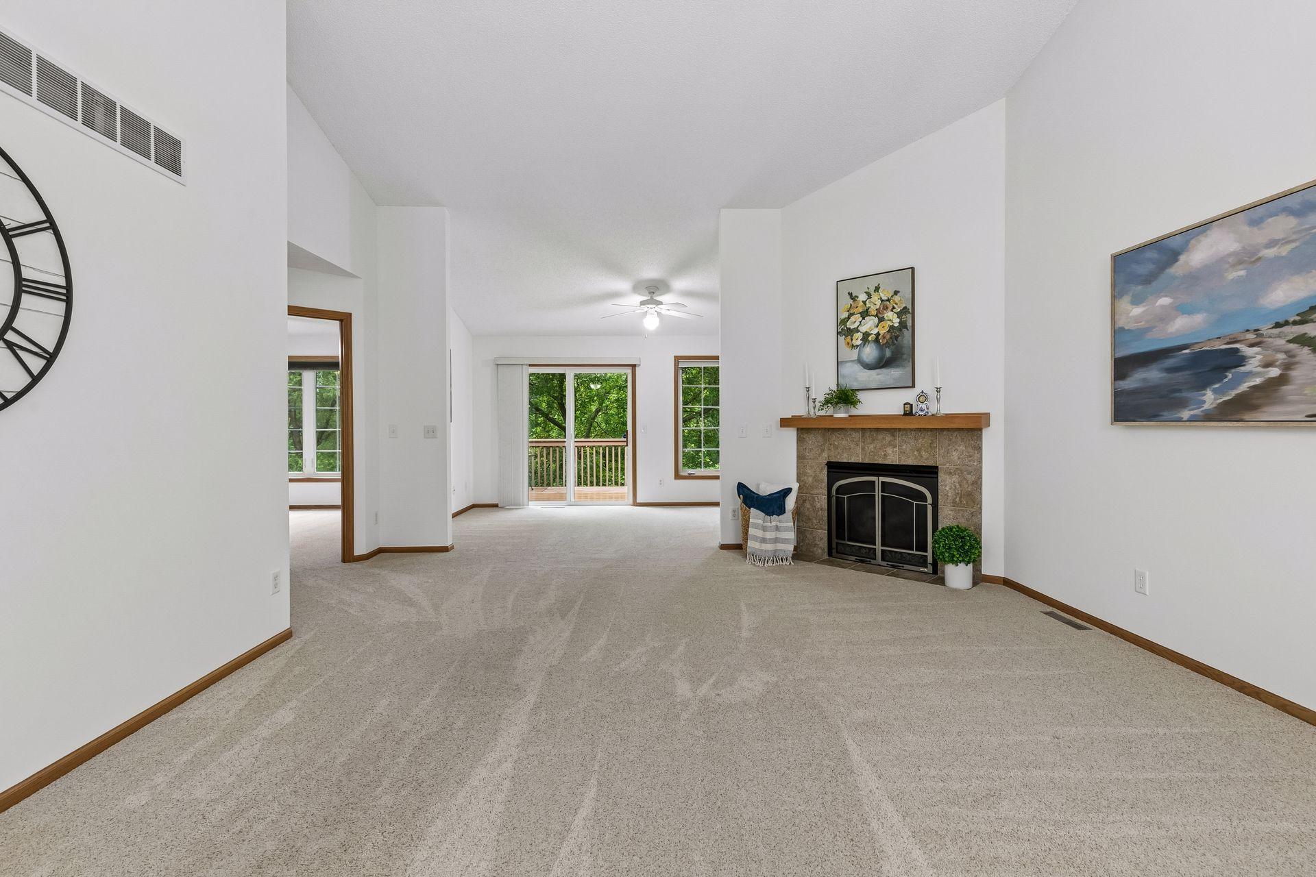 Spacious living room with gas Fireplace, walkout to deck from sunroom