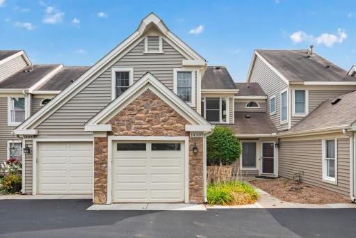 Sharp-looking townhome with stone exterior and architectural details