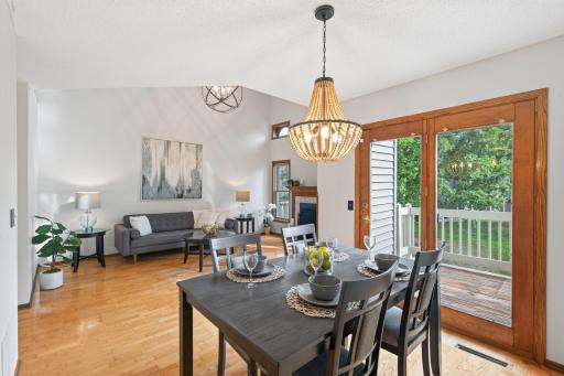 Dining room into living room, exterior doors to deck