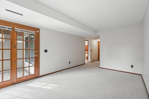 Another view of the family room, looking into the bathroom and hallway to stairs