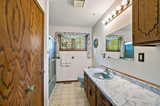 Large main level bathroom has a huge vanity with lots of storage.