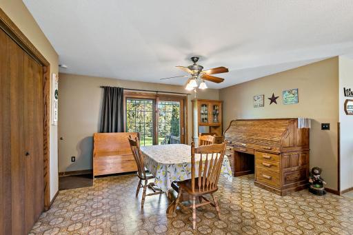 Bright dining area looks out on the back deck and gorgeous yard.