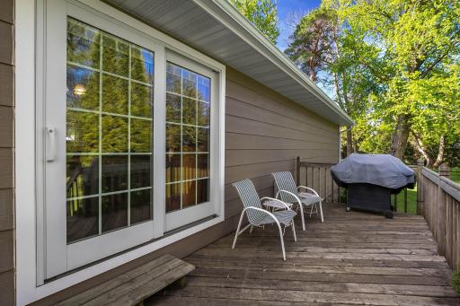 Convenient deck and newer patio doors to enjoy the beautiful backyard.