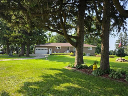 Beautiful landscaping accents this wonderful property.