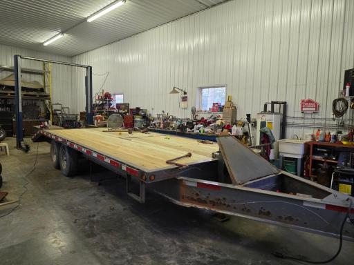 This amazing shop has in-floor heat, 12" concrete towards front for a semi, 14 x 20 overhead door, hot water & more!