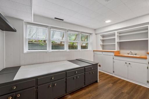 Basement flex room with sink and shelving. Could also be used as a 6th bedroom (non-conforming).